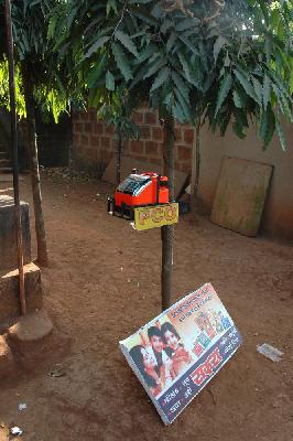 A telephone tied to a tree trunk