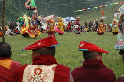 Two lamas are fascinated by the religious dances